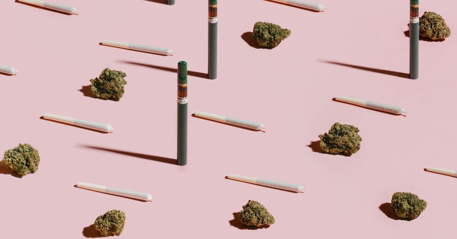 Pink Kush buds, pre-rolls, and vapes on pink background