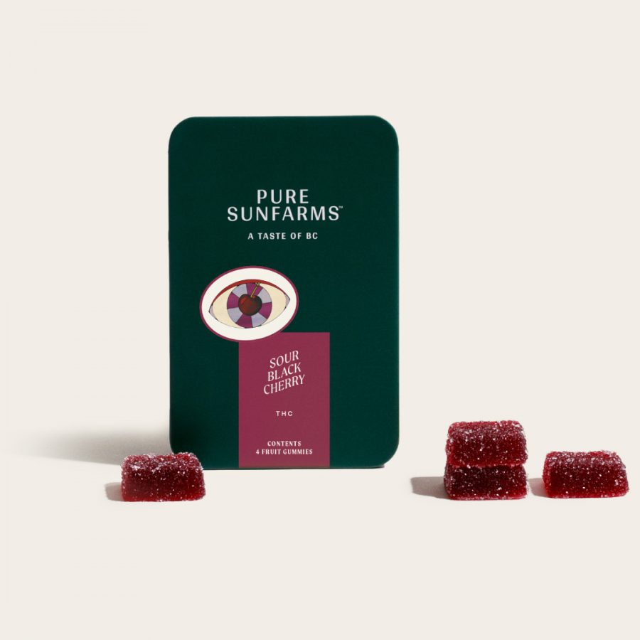 Sour Black Cherry gummies with packaging on cream background
