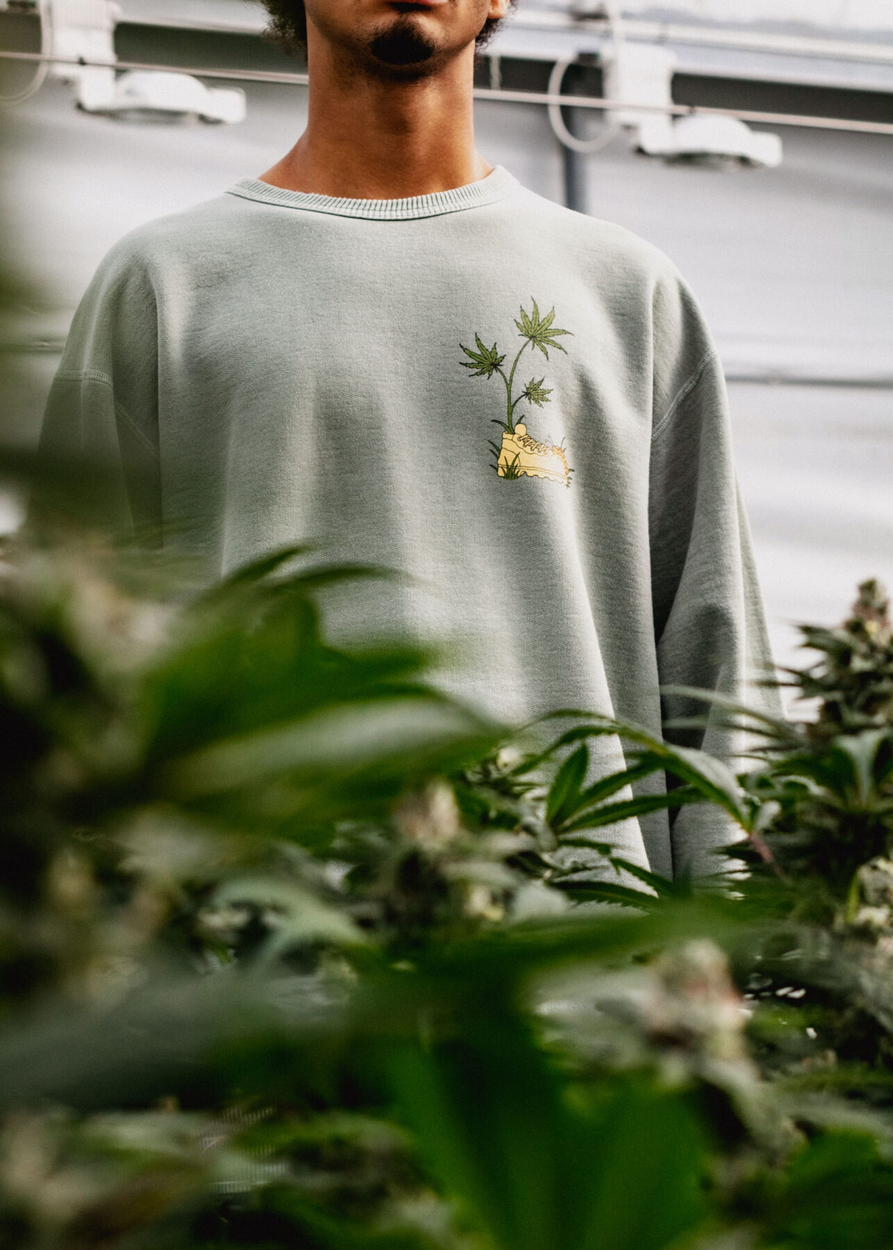 model wearing Flowerhood garments in greenhouse