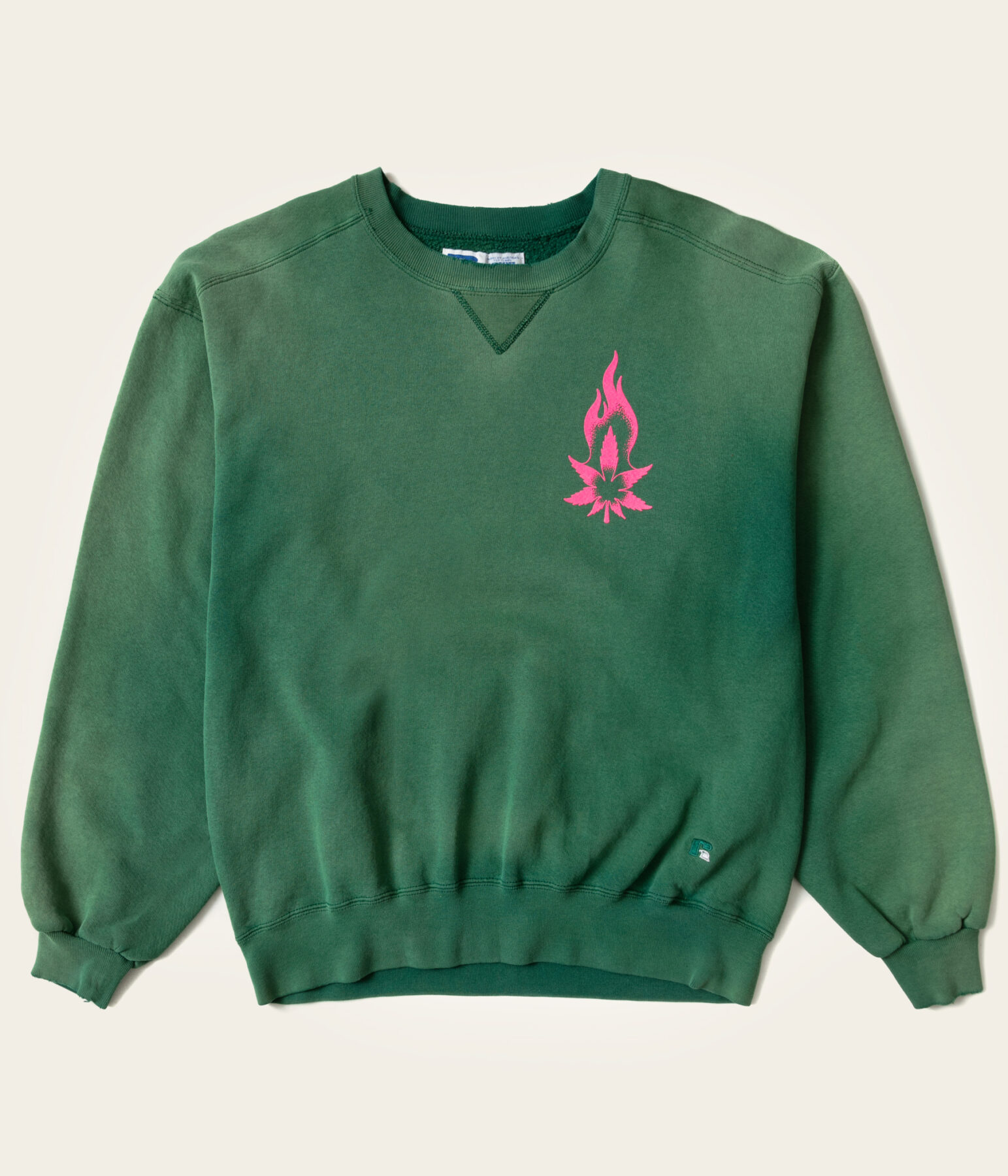 Green crewneck with flame graphic