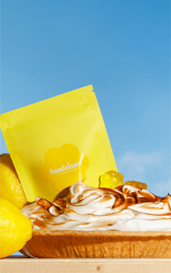 Sundaisies yellow concept packaging and gummies in a lemon meringue pie.